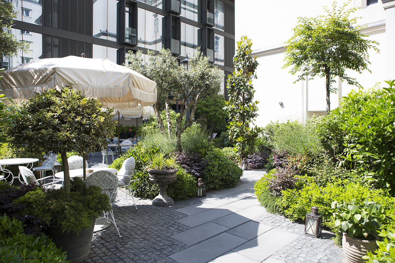 The courtyard with potted plants and covered seating